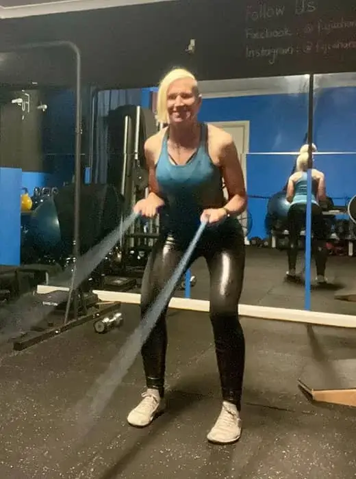 A one-on-one personal training session in a gym