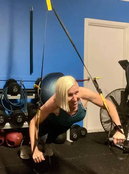 Personal fitness instructor guiding through intense workouts